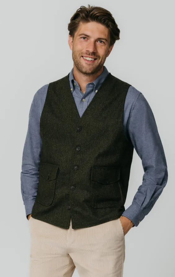 Gilet en tweed vert à chevrons avec poches plaquées Gilet en tweed vert à chevrons avec poches plaquées