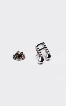 Badge de revers en forme de note de musique argentée